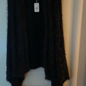Super soft high low vest very soft shaggy material